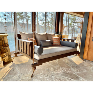 Cabana Bed Swing with a full size mattress.  This close up image shows the color of both the cushions and the rich brown finish on the wood.